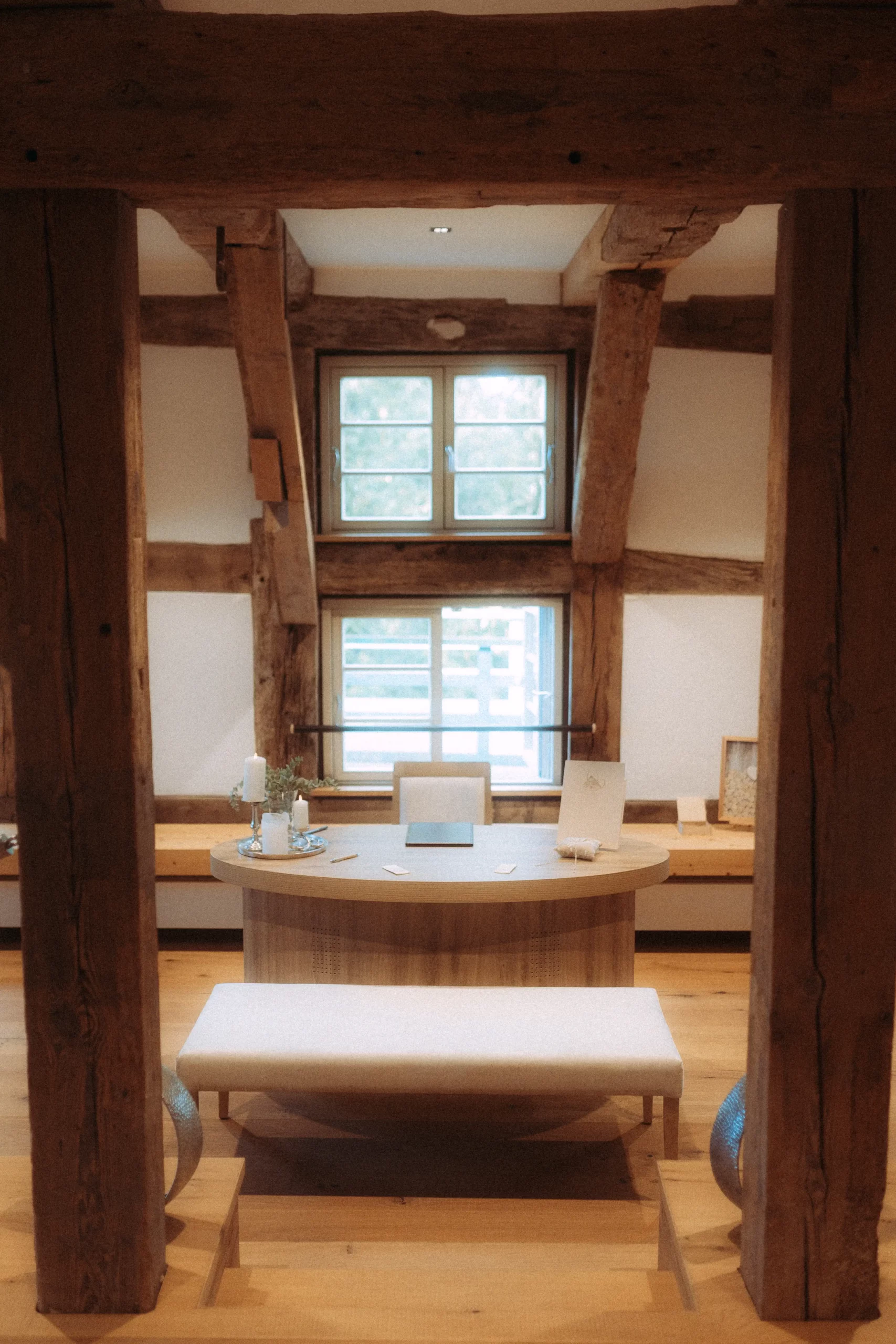 Rustic desk in timber frame room